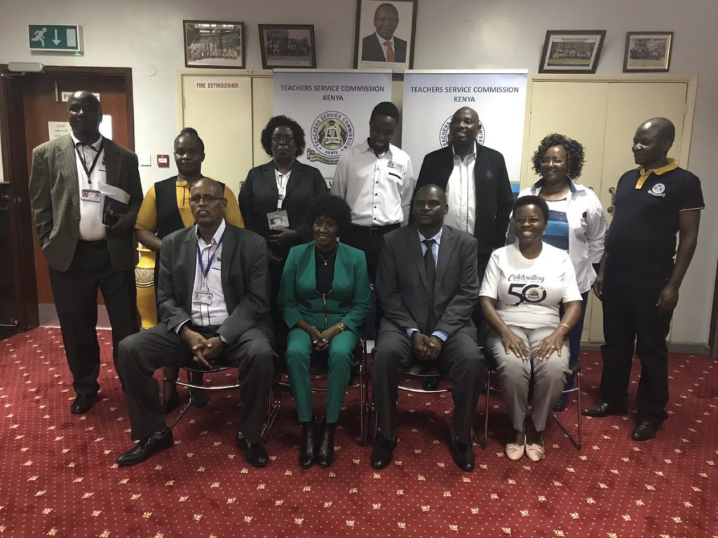 Mr. Eric Ademba, second right, winner of the 2019 edition of the African Union Continental Teacher Award is congratulated by the TSC Secretariat . Photo/ File.