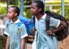 Learners walk home after schools were closed due to the outbreak of Covid-19 pandemic. The government is finding itaself within a hard place and a rock on making a decision whether to reopen schools soon or not.